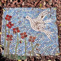 Mosaic artwork on the ground to the left of the Commemorative Wall