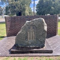 Plaque on stone remembers all locals who served