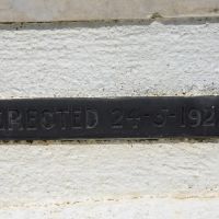 The plaque marking the date of the Memorial dedication