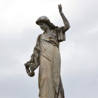  The figure of "Remembrance" holding a wreath