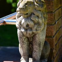 One of the lions overlooking the steps to the sculpture