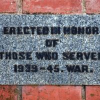 The plaque on the left gate pilar commemorates those who served during the Second World War