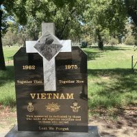 Vietnam War memorial, with gun behind