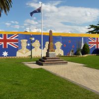 The St Helens War Memorial is located within the park, standing in front of the huge service mural