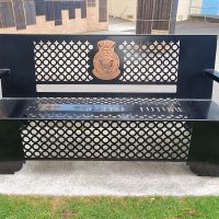 Park seating, with the logo of the Australian Navy Cadets