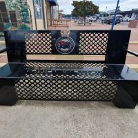 Park seating, with the emblem of the RSL Women's Auxiliary