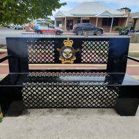 Park seating, with the emblem of the Royal Australian Air Force