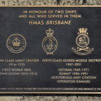 The plaque commemorating both ships commissioned as HMAS Brisbane