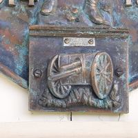 Close up detail of base of Roll of Honor, reads "Gunderson, 154 Edward St, Brisbane"