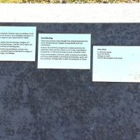 The second group of interpretive panels. One has the first verse of the poem 'River Music'