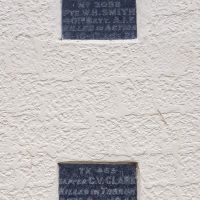 Two of the individual plaques on the front of Winnaleah Memorial Hall
