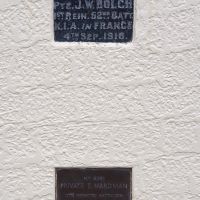 Two of the individual plaques on the front of Winnaleah Memorial Hall