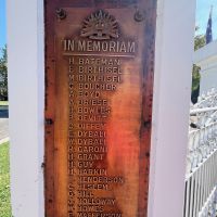 Plaque on left side of Memorial Gate