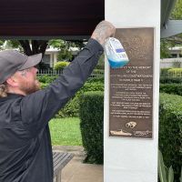 Plaque being installed