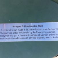 Plaque on Krupps 9 cm gun, reads " Krupps 9 Centimetre Gun.  This is a 9 centimetre gun made in 1875 By German munufacturer Krupps.  The gun was gifted to Australia by the French Government.  It is likely that this gun is the oldest example of German artillery that remains in Australia and it is one of only two known to exist in Australia."