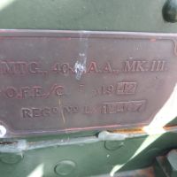 Plaque on side of 40mm gun reads "MTG., 40mm. A.A., MK.III. O.F.E./C. 1942 REGd No L/12407" with some small hallmarks visible.