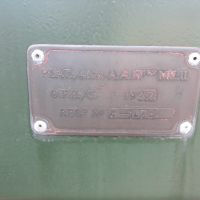 Plaque on side of 40mm gun, reads "PLAT., 40mm A.A.Mtcs MK.II. O.F.E./C. REGd No P-10782" with hallmarks visible.