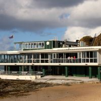 The Currumbin Beach Surf Club with Elephant Rock in the Background and the "Anzac Story" Commemorative Plaque at its base (Plaque Damaged during Cyclone Alfred in early 2025)