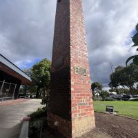 The belltower stands next to the church