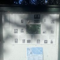Information panel near the memorial trees, providing locations and details of each person honoured
