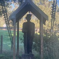 Sculpture at the end of the pedestrian suspension bridge leading to the reserve