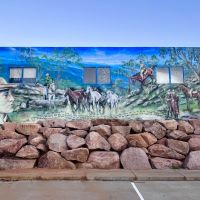First image on mural: Banjo Patterson, mustering the wild horses, and a verse from the ballad