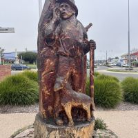 Sculpture carved from Deodora cedar from the original plantings and is dedicated to those of the farming community who served in various 20th century conflicts. Chainsaw sculpture by Kelvin Guilders, 2009