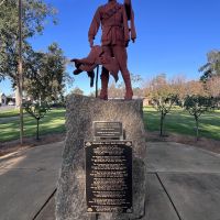 Lighthorseman and saddle, wth plaque below