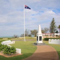 Emu Park War Memorial Encompassed by Honour and Commemorative Walls with Anzac Court in the Background